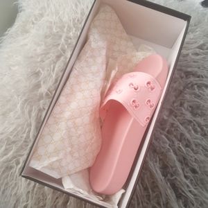 Women's pink Gucci Slides